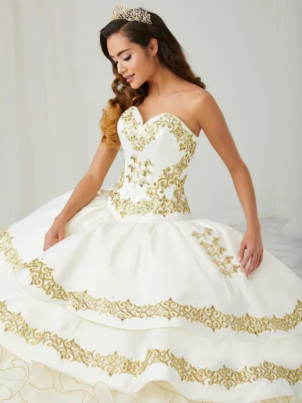 White charro-style Quinceañera ball gown with ruffled skirt